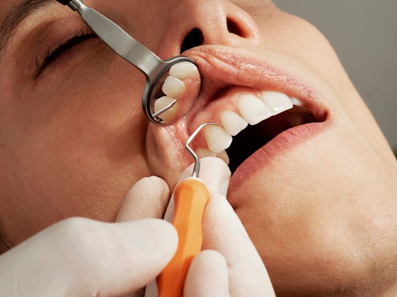 Dentist consulting with a patient about implants and orthodontics